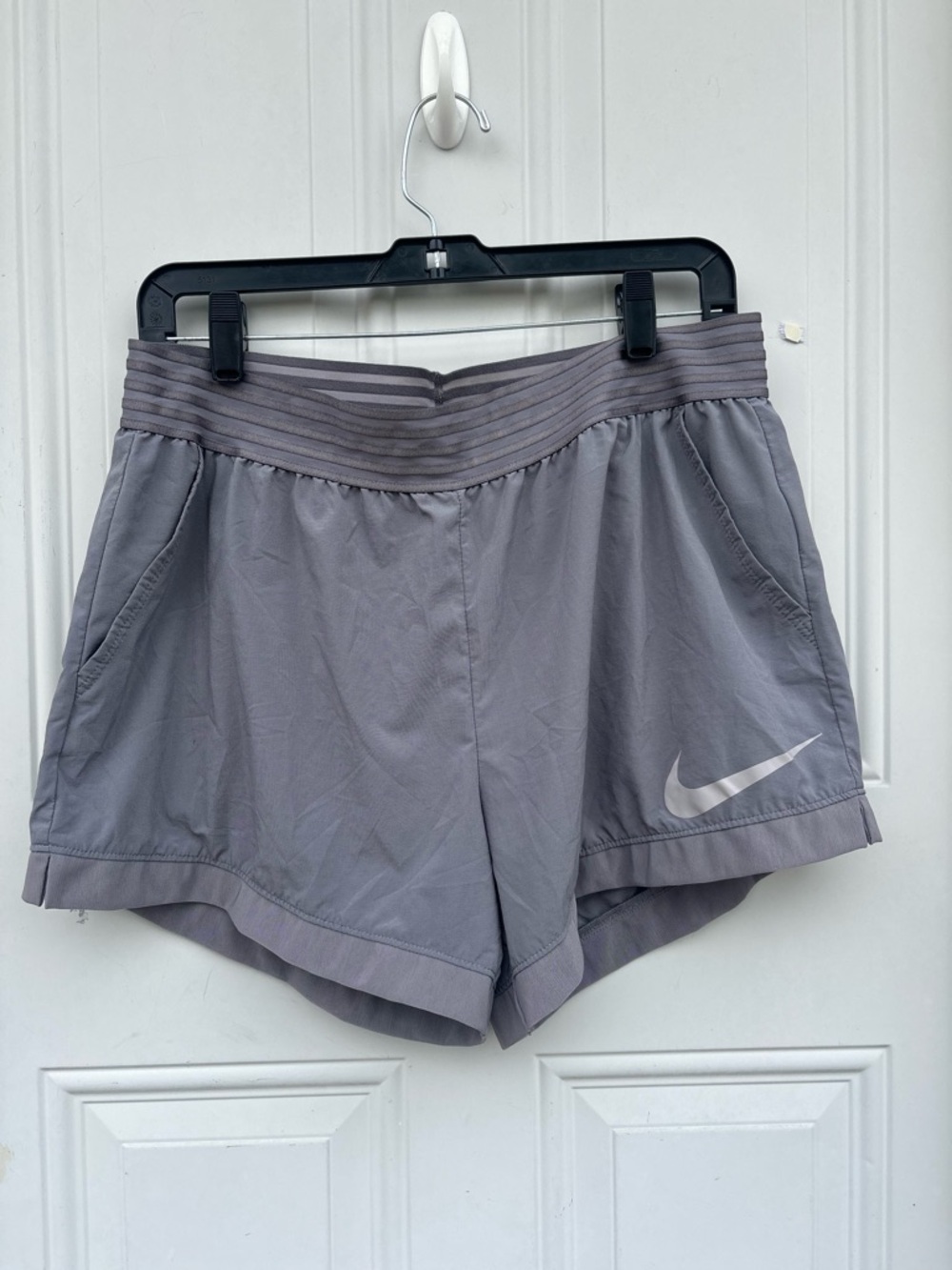 Nike Women's Light Gray Athletic Shorts with Reflective Swoosh